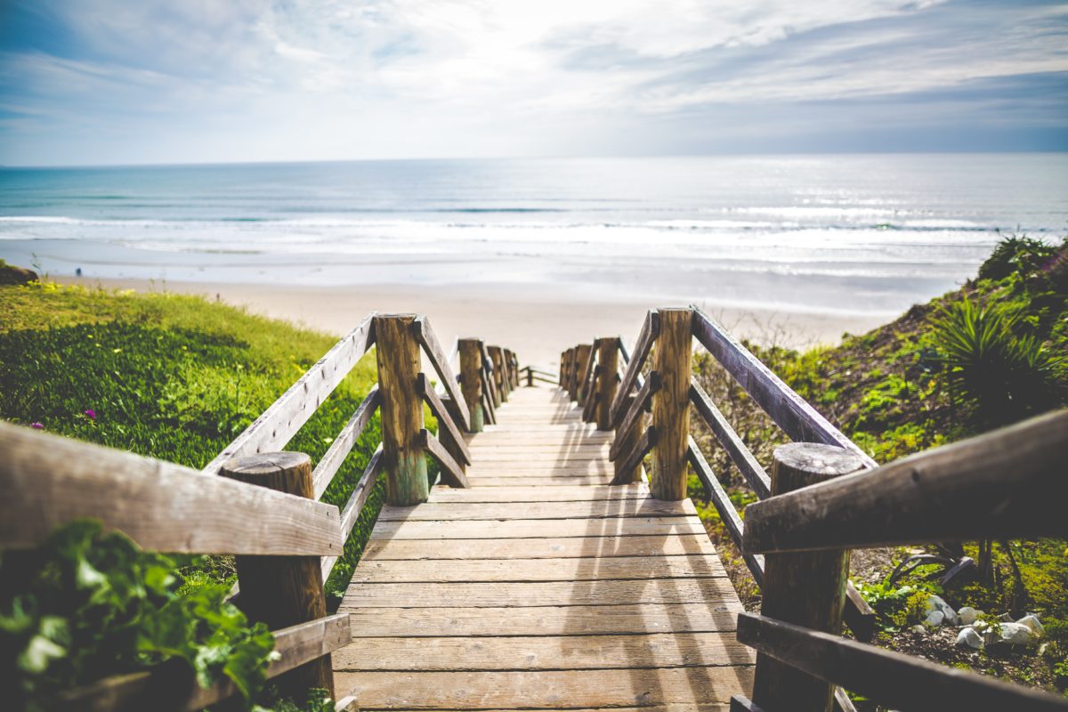 wooden walkway to beach during the day