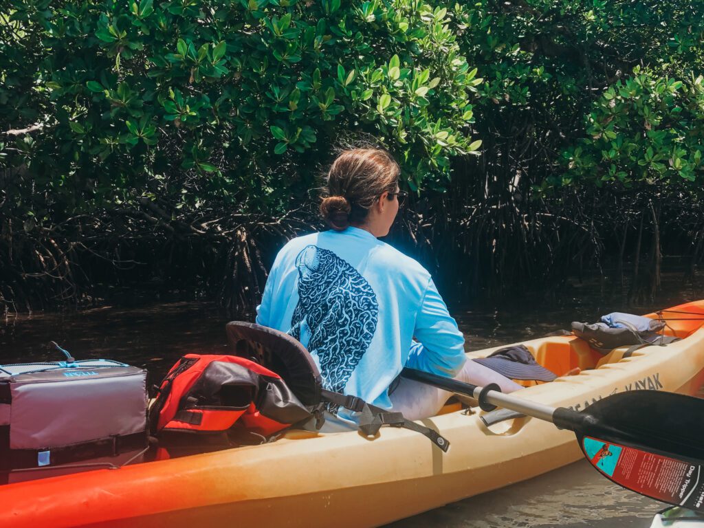 woman kayaking in mangroves