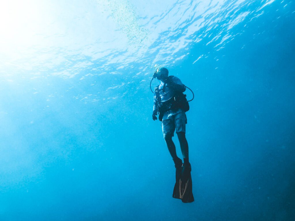 scuba diver ascending in fort lauderdale during drift dive