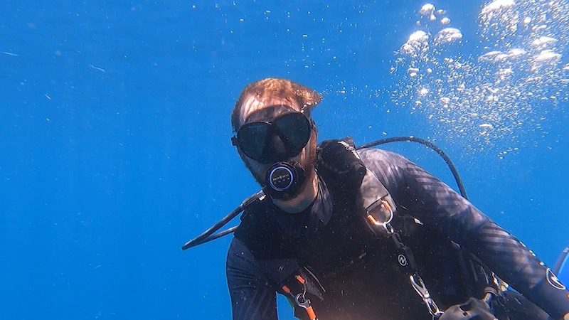 man scuba diving on northside of st thomas usvi