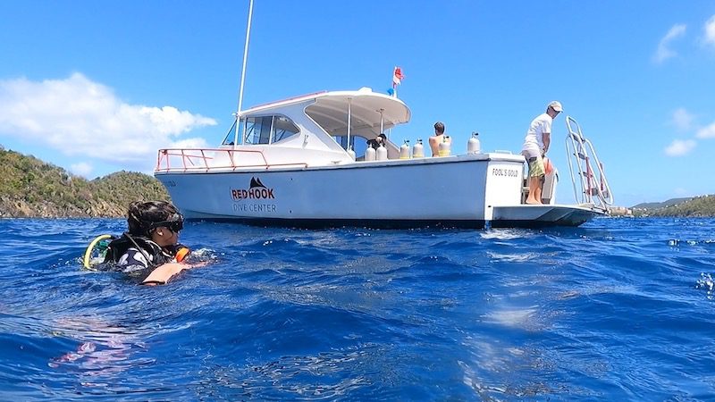 woman getting picked up during drift dive in st thomas usvi