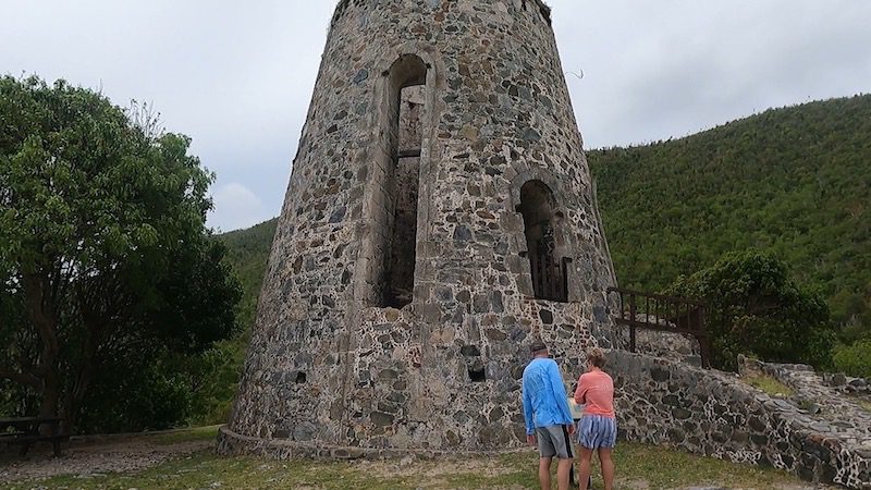 two people looking at windmill at annaberg sugar plantation usvi
