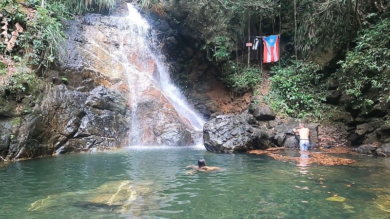 man and woman swimming in natural pool charco el pilon puerto rico